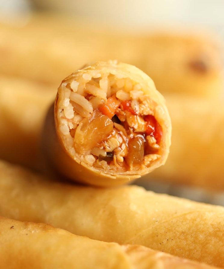 closeup shot of sweet and sour chicken filling inside spring roll
