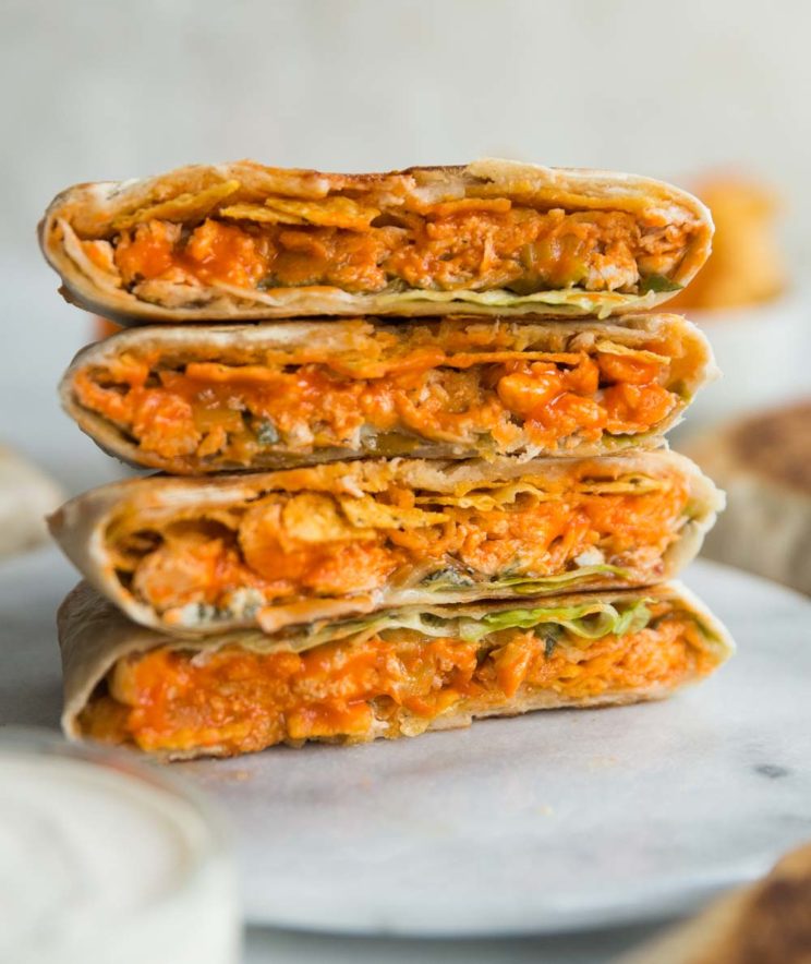 crunchwraps stacked on top of each other on marble board