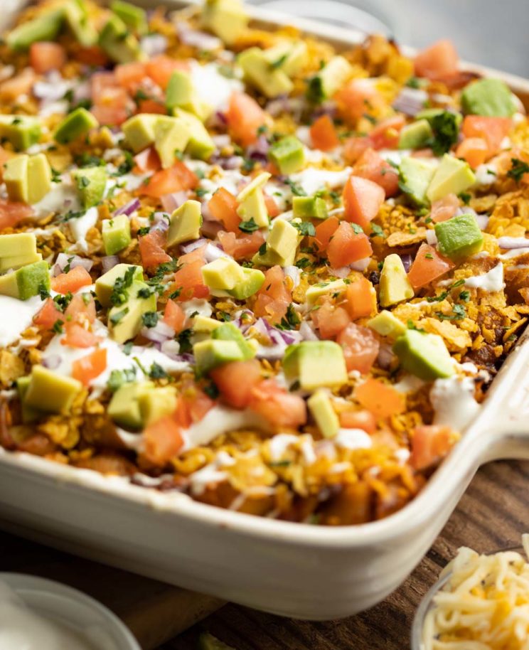 close up shot of taco pasta in dish with toppings