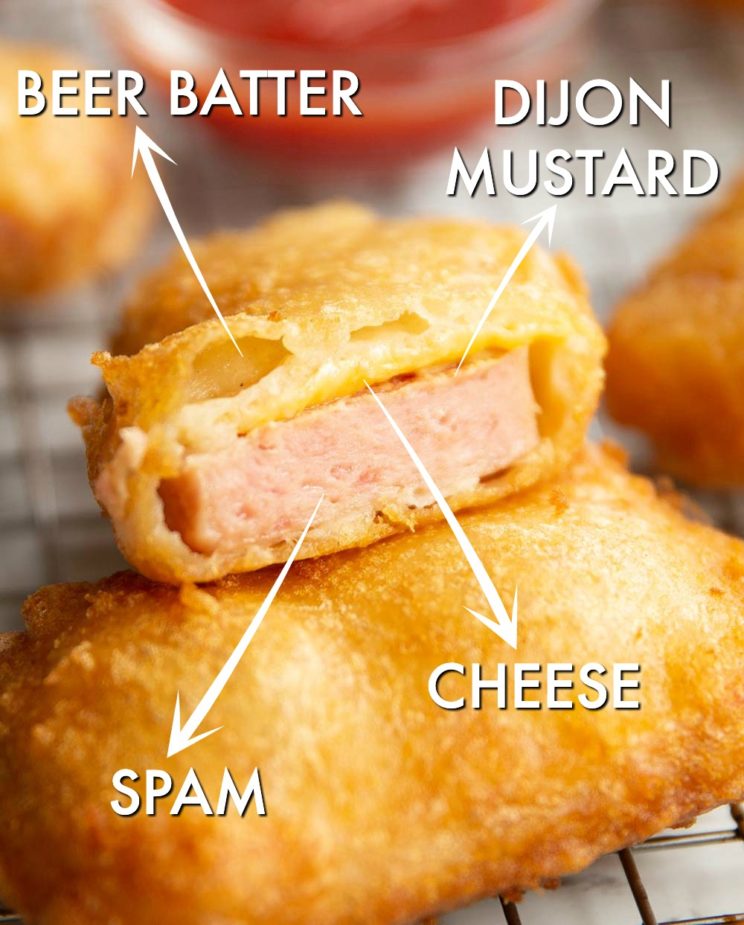 spam fritter sliced open with labels for ingredients