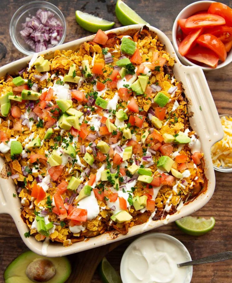 overhead shot of taco pasta with taco ingredients on top in casserole dish