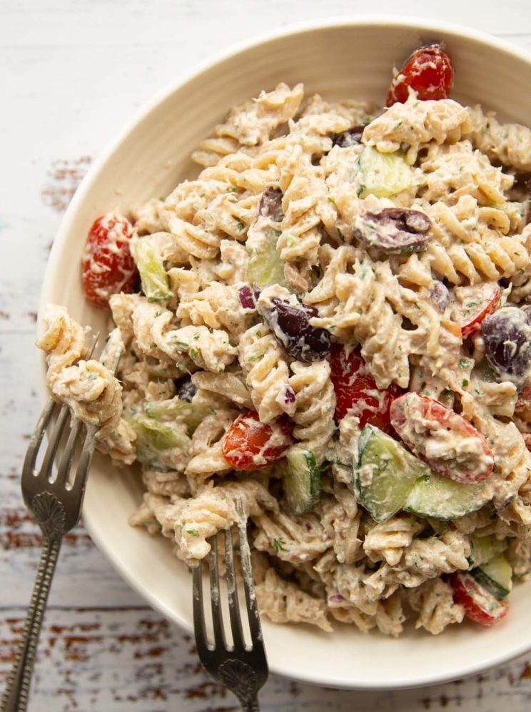 overhead shot of pasta salad in white bowl