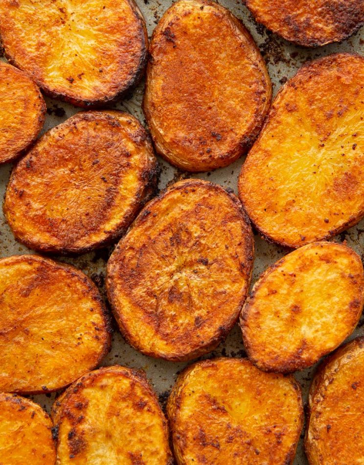 overhead shot of potatoes fresh out the oven in grey baking tray