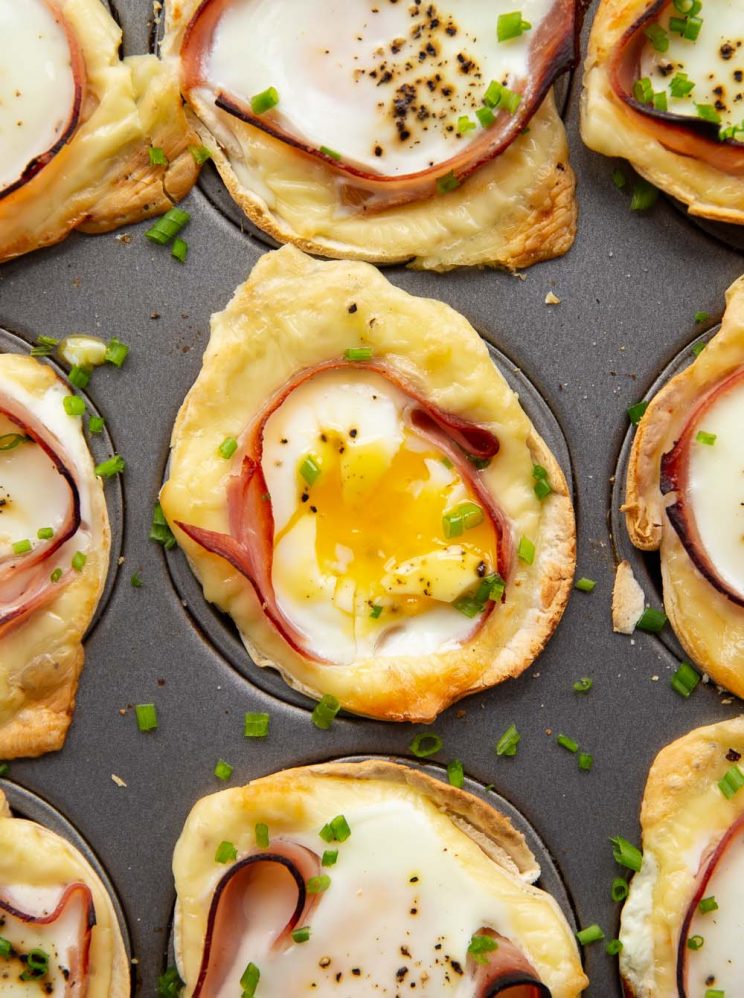 overhead shot of egg cups fresh out the oven with egg yolk showing