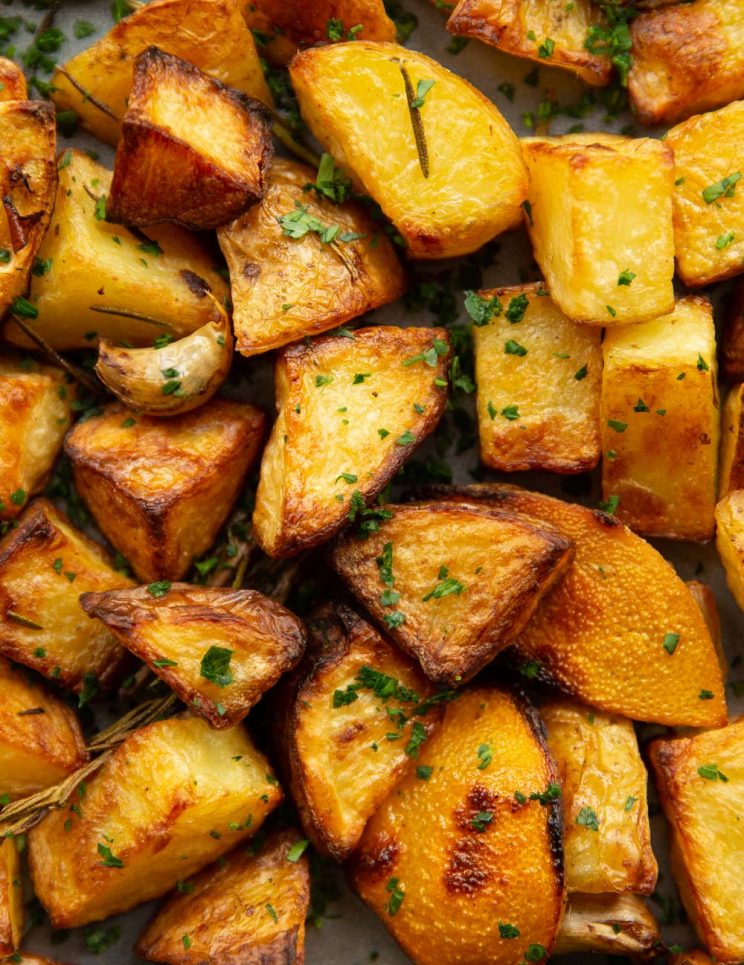 overhead shot of potatoes garnished with parsley fresh out the oven