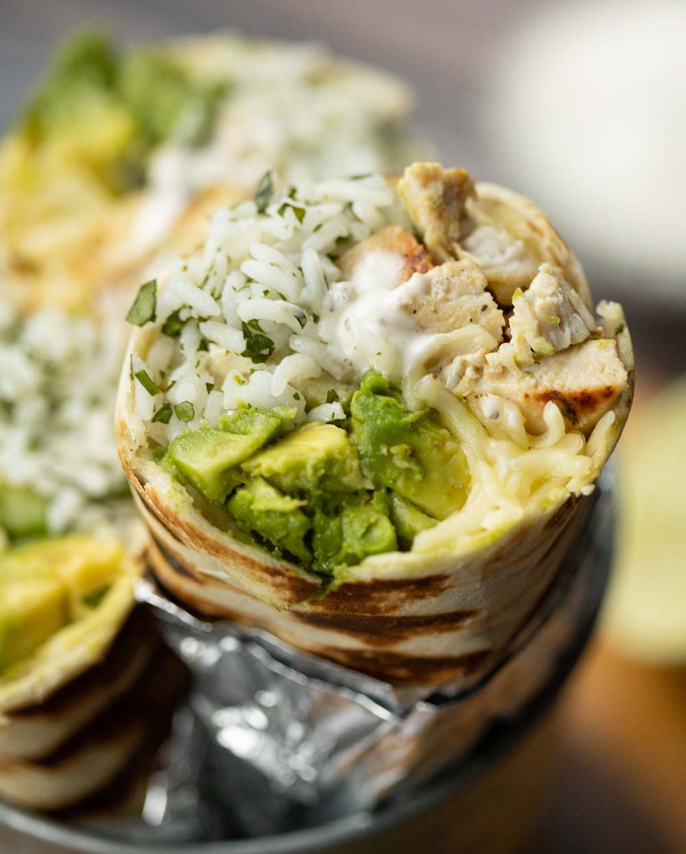 Chicken Breakfast Burrito / 1 / Prepare the burrito with the chicken, eggs, red pepper, then top with cheese.