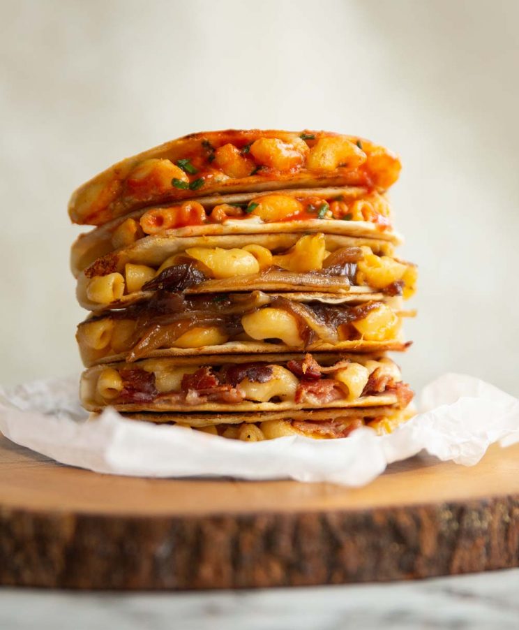 6 quesadillas stacked on each other on wooden block