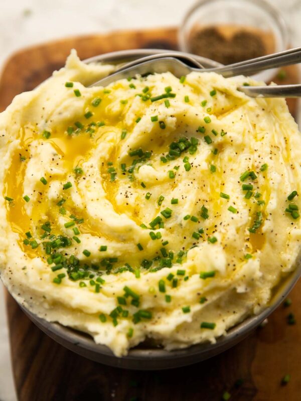 Boursin mash served in bowl with melted butter and chives