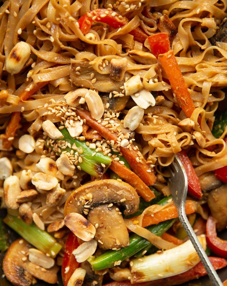 overhead shot of stir fry in wok with silver fork digging in