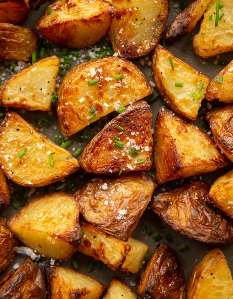 overhead shot of roasted potatoes in oven tray fresh out the oven