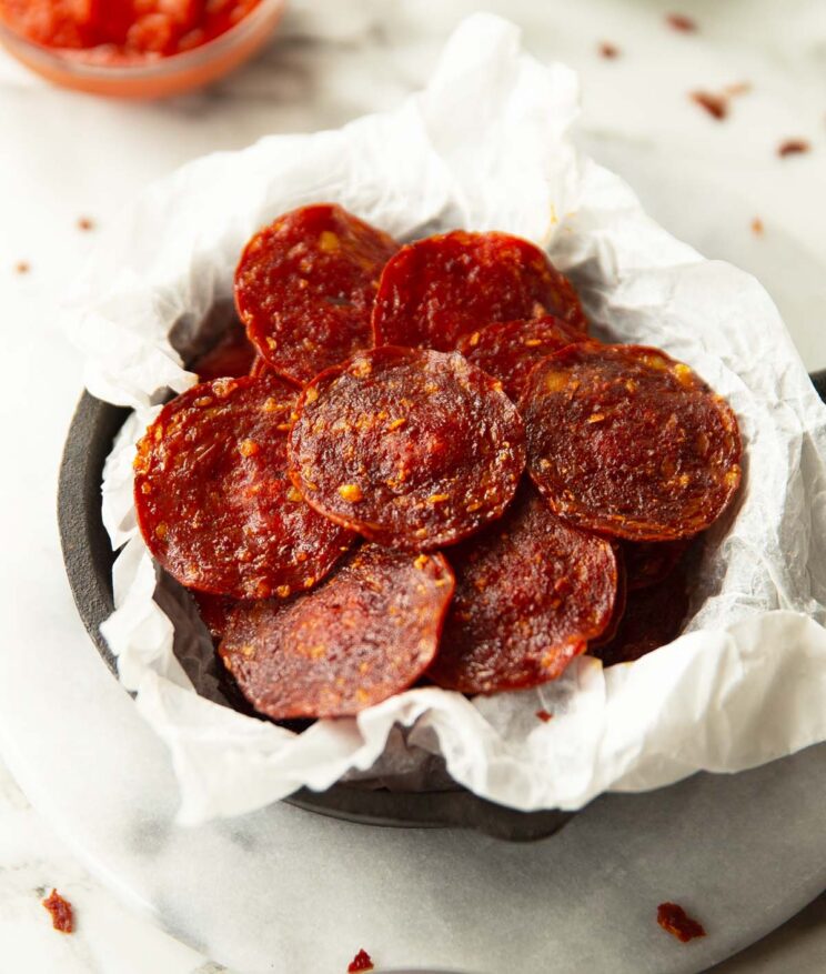 pepperoni chips in parchment paper in mini cast iron skillet