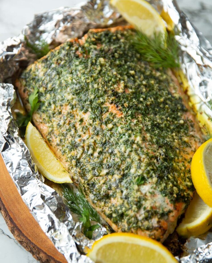 baked salmon wrapped in foil fresh out the oven garnished with lemon wedges