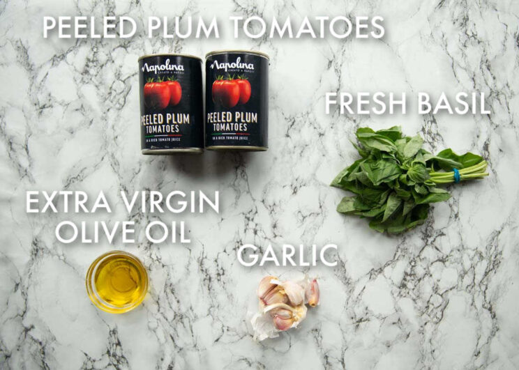 overhead shot of ravioli tomato sauce ingredients with text labels