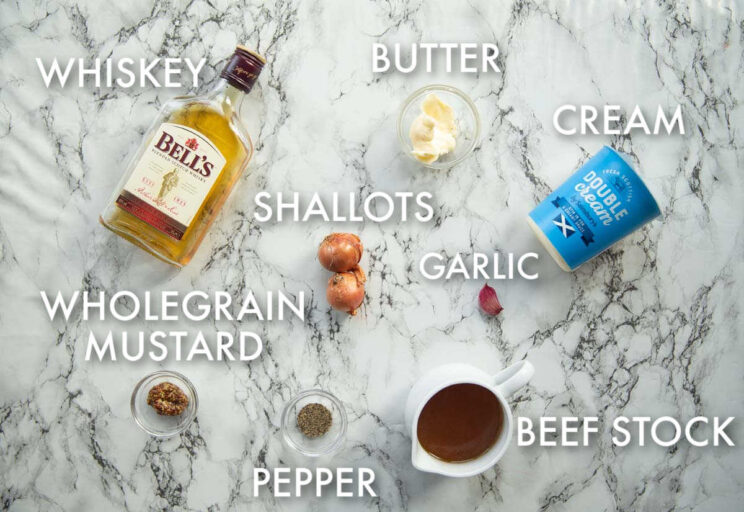 overhead shot of whiskey cream sauce ingredients with text labels