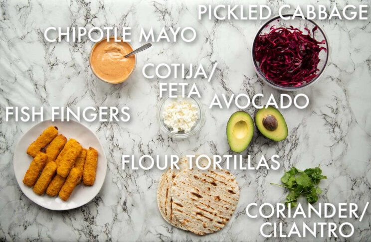 overhead shot of fish finger taco ingredients with text labels