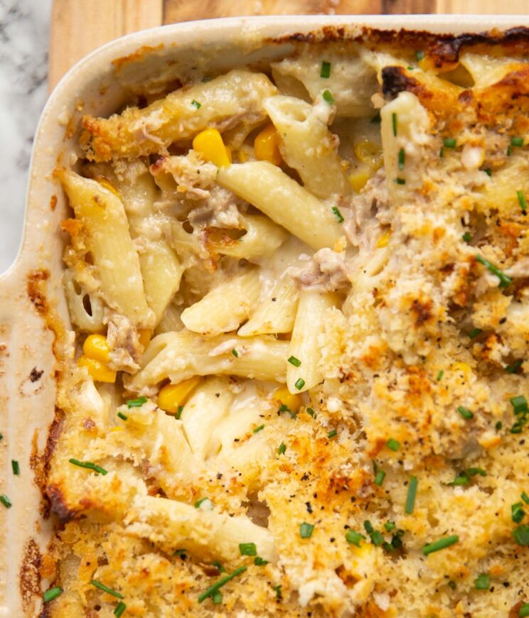 overhead shot of creamy tuna pasta bake fresh out the oven with some scooped out
