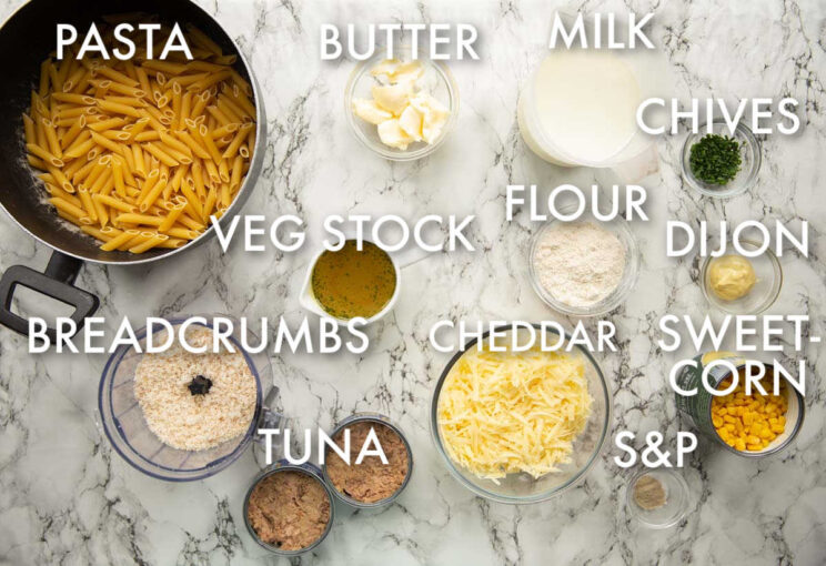 overhead shot of creamy tuna pasta bake ingredients with text labels