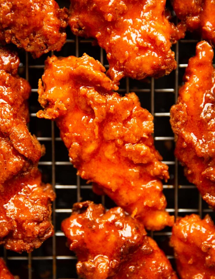 close up overhead shot of nashville fried chicken on wire rack