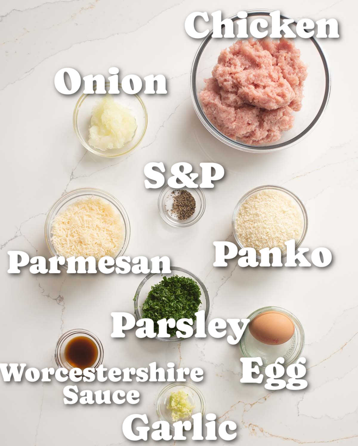 overhead shot of chicken meatballs ingredients with text labels