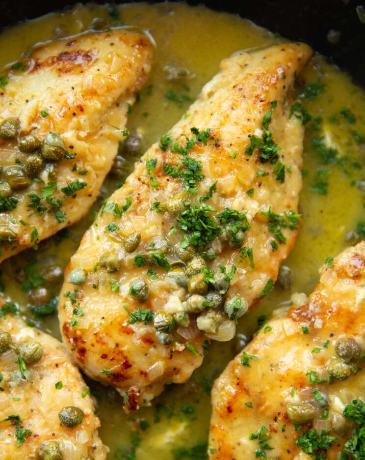 overhead close up shot of chicken piccata in pan
