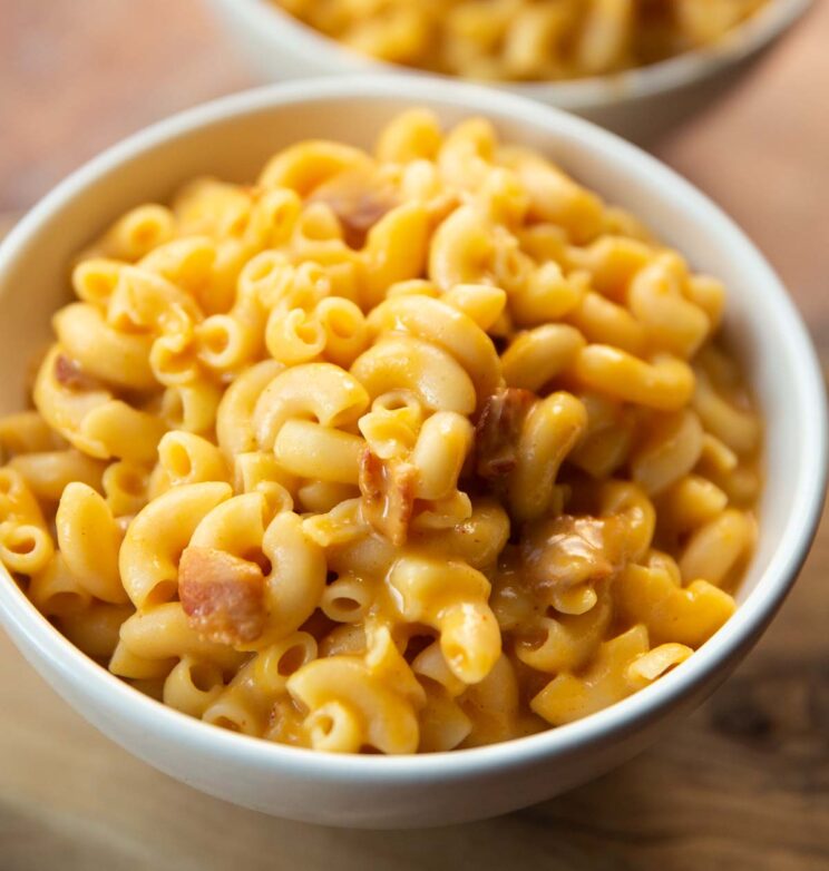 close up shot of butternut squash mac and cheese in small white bowl