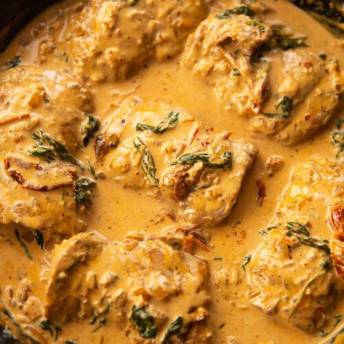 creamy cajun chicken in a large cast iron skillet
