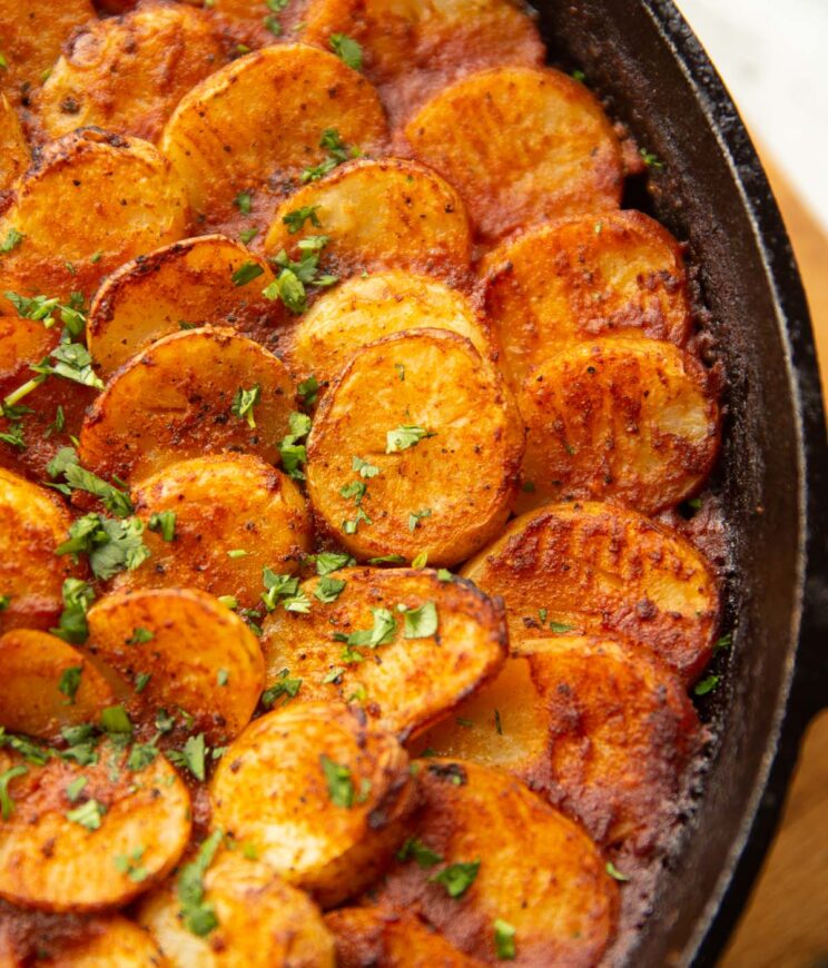 close up shot of beef chilli hotpot fresh out the oven garnished with coriander