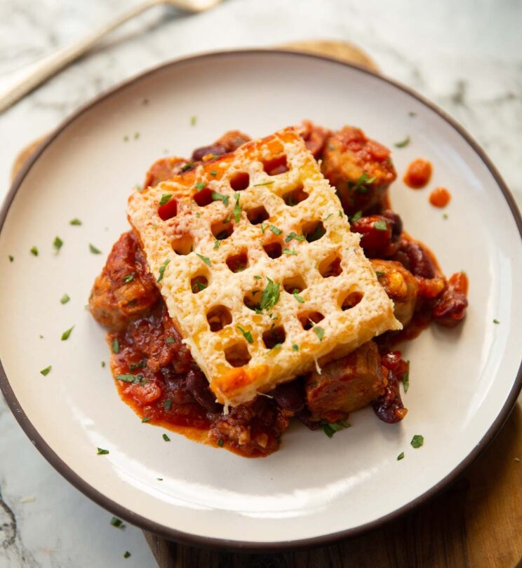 close up shot of cowboy pie with waffle on small white plate