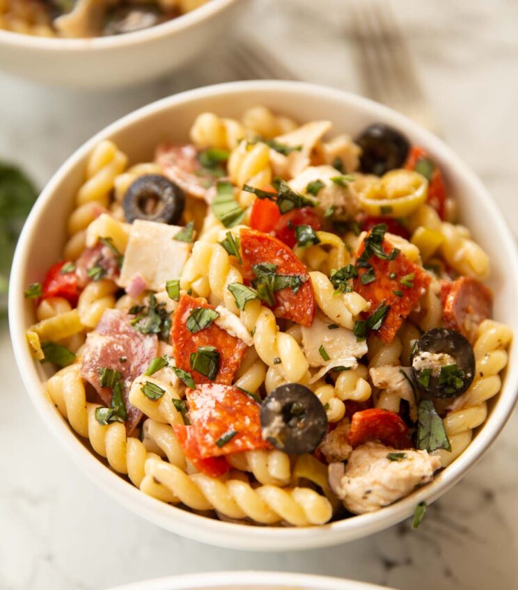 close up shot of Italian sub pasta salad in small white bowl