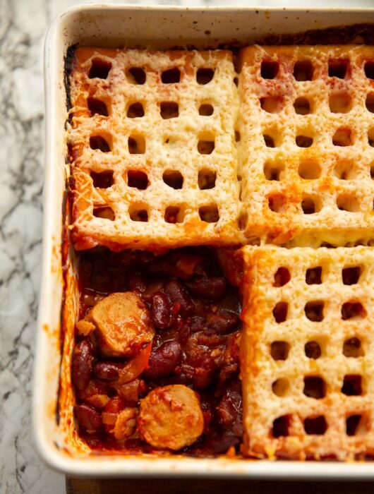 overhead shot of waffle cowboy pie with one waffle missing showing filling