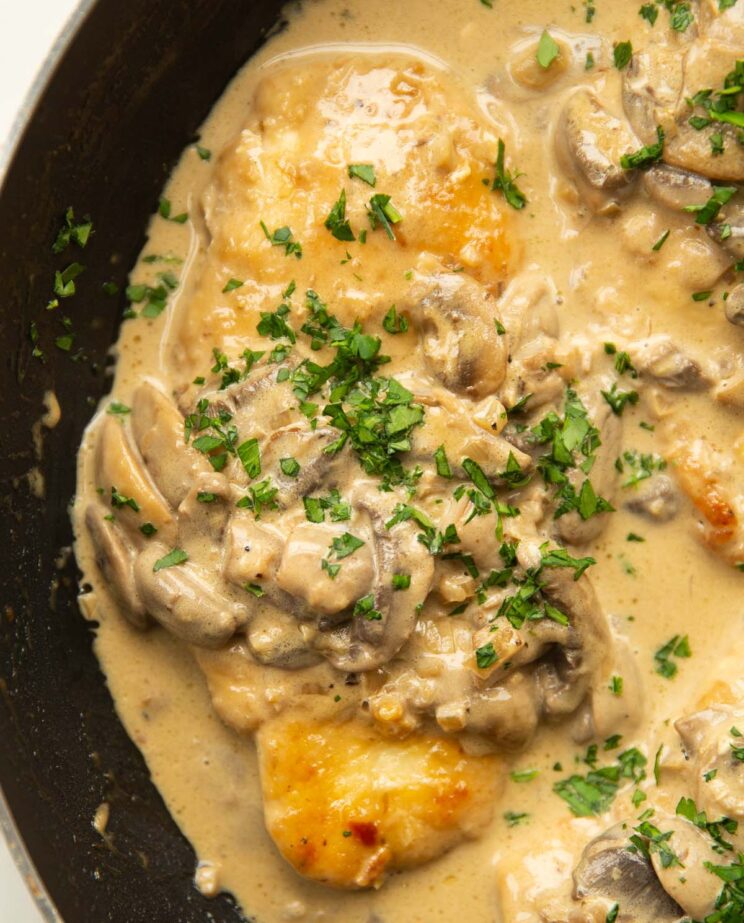 close up overhead shot of in pan garnished with parsley