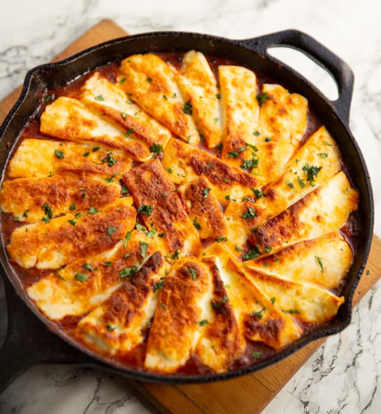 halloumi hotpot fresh out the oven on wooden chopping board