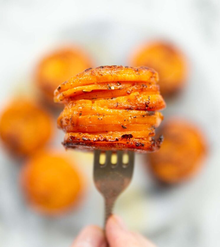 close up overhead shot of buttery sweet potato stack on silver fork