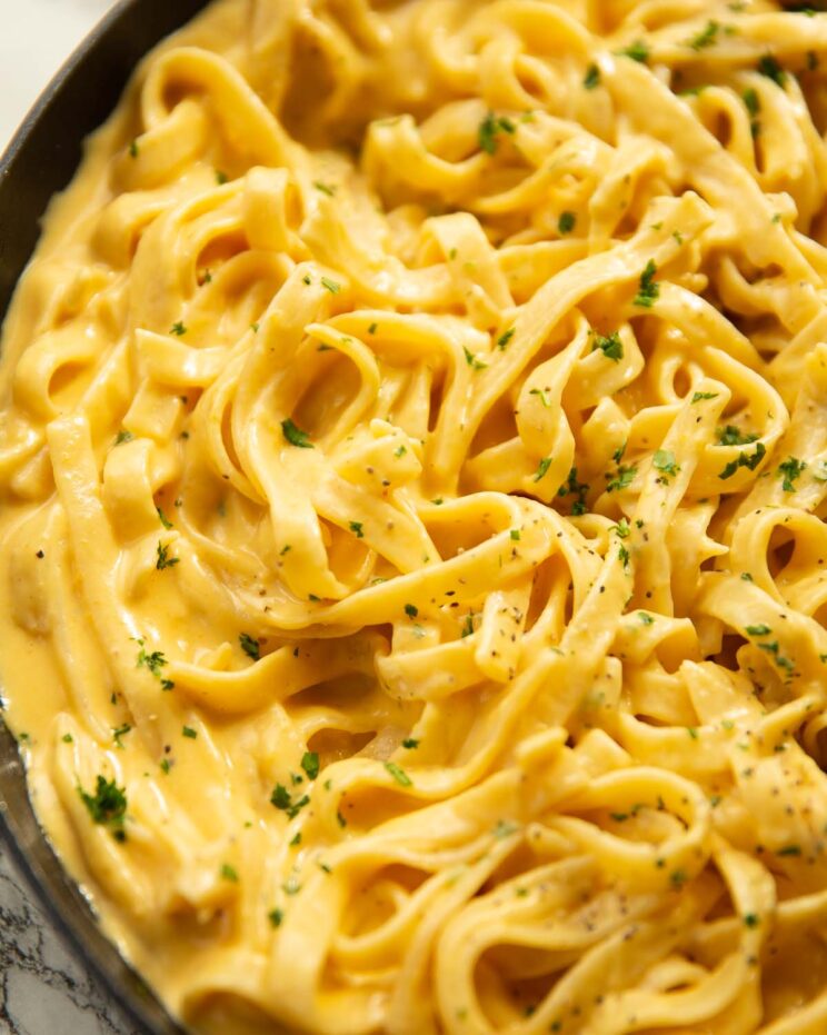 close up shot of creamy pumpkin alfredo in large pan