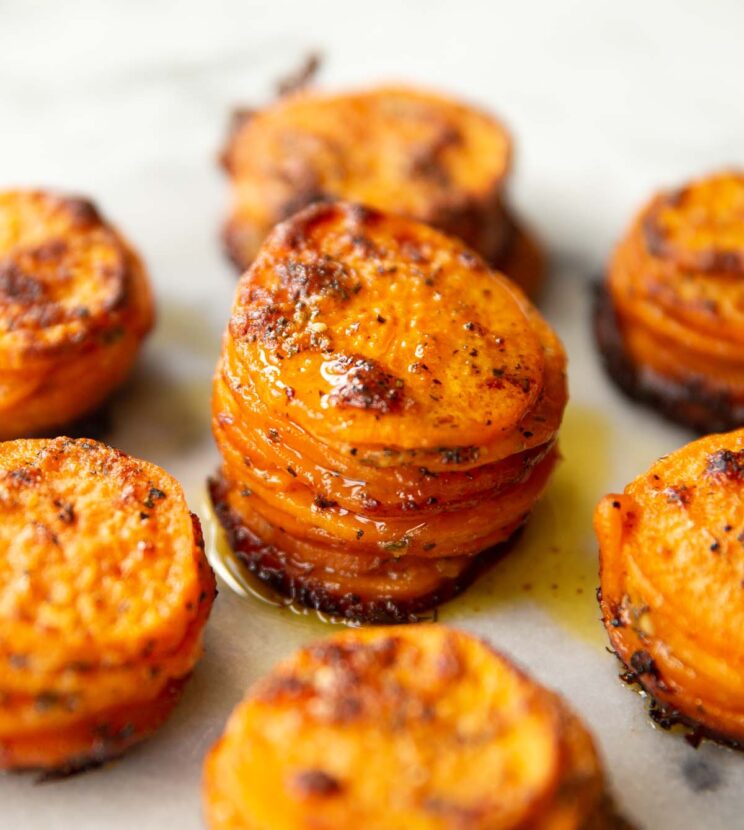 7 garlic butter sweet potato stacks on small marble board