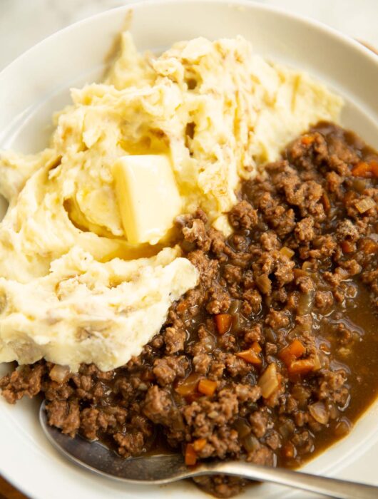 mince and tatties served in large white bowl with silver spoon