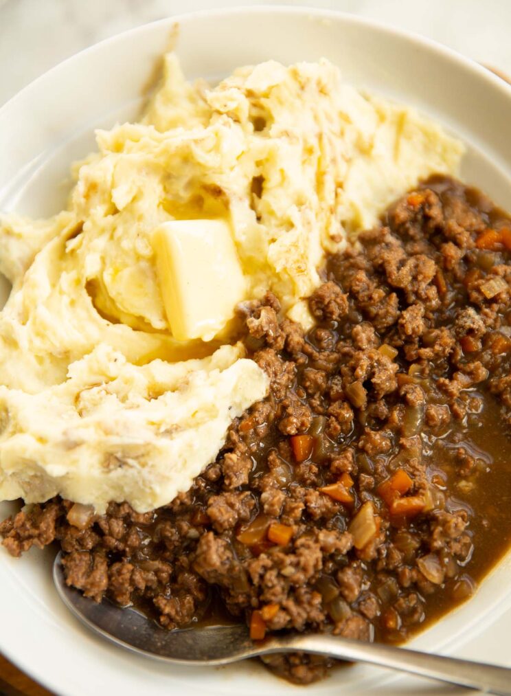 mince and tatties served in large white bowl with silver spoon