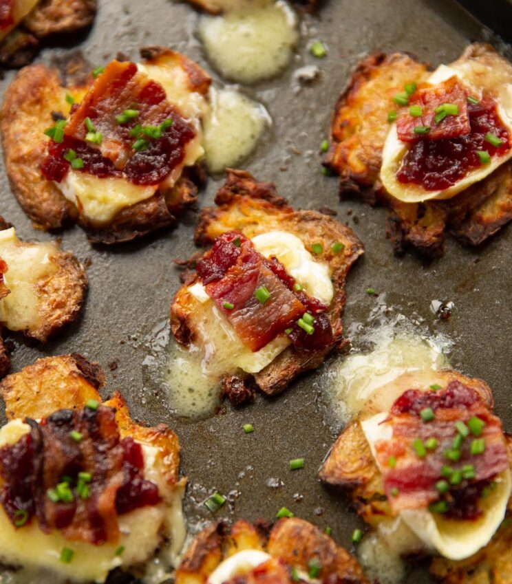 brie bacon cranberry smashed potatoes on baking tray fresh out the oven