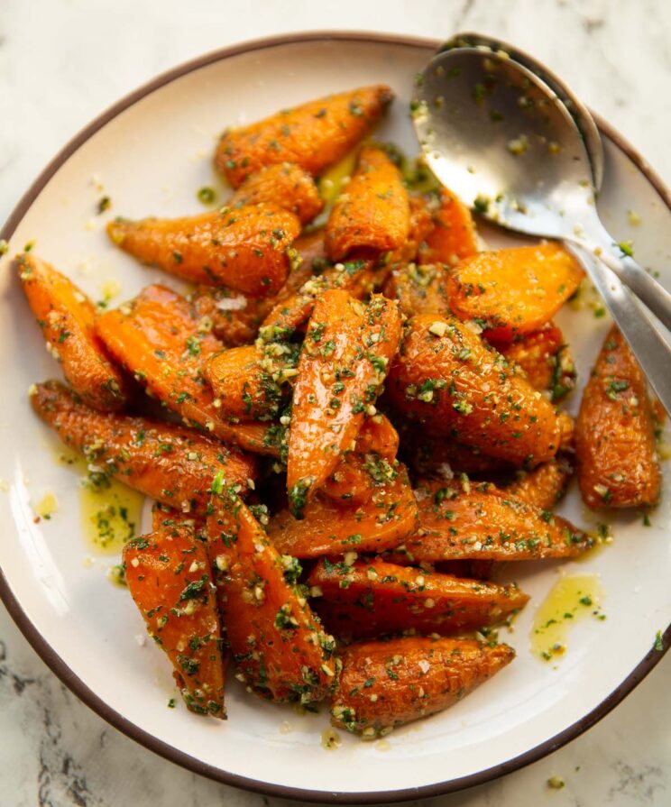 overhead shot of garlic butter roasted carrots on small white plate