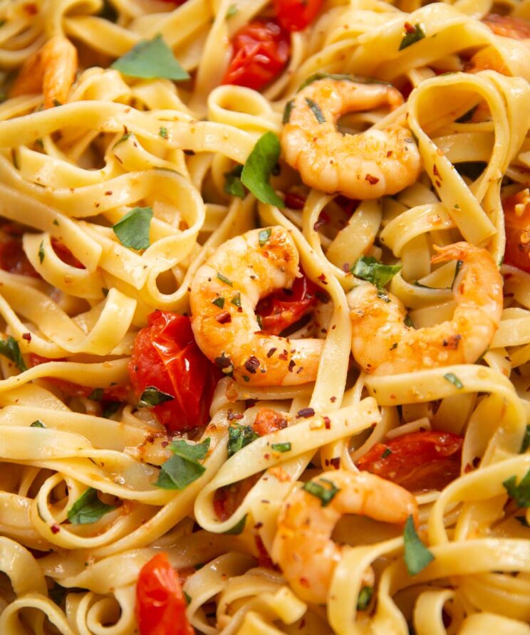 close up shot of tomato prawn pasta in pan
