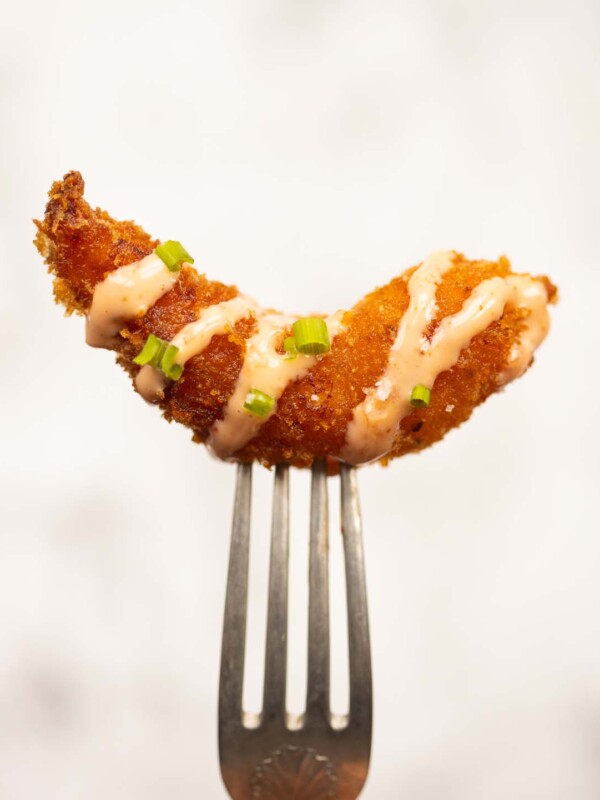 close up shot of bang bang shrimp on silver fork