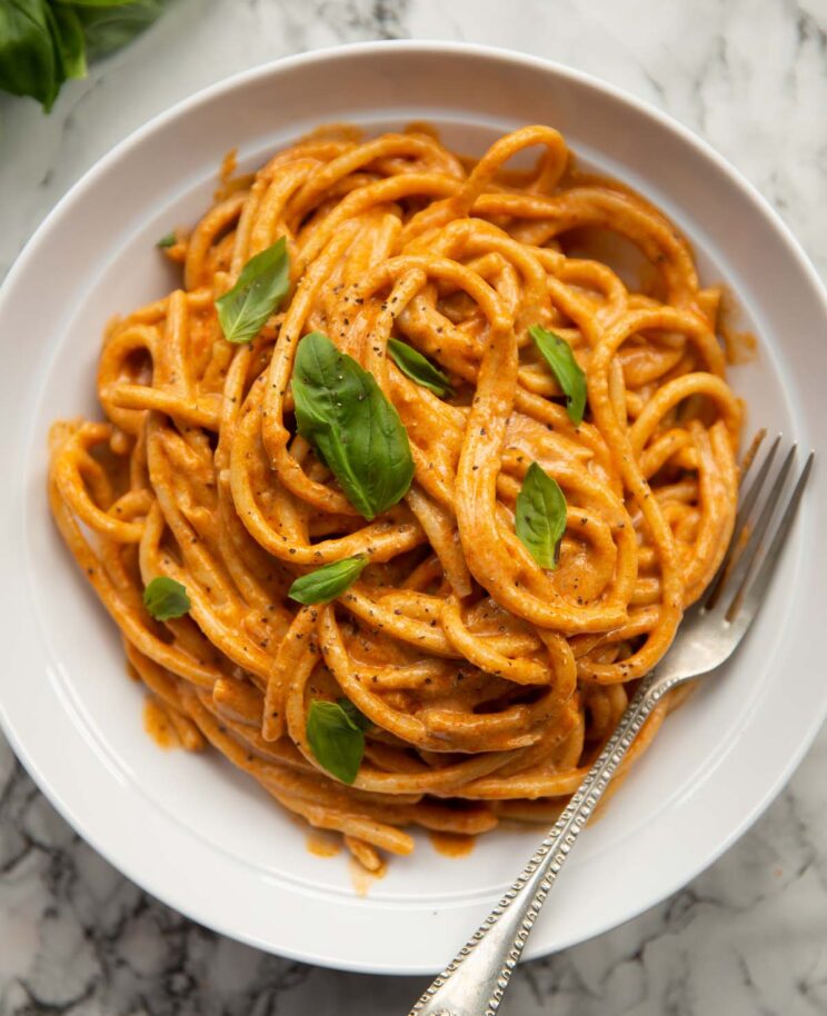 overhead shot of cottage cheese pasta in large white dish with silver fork