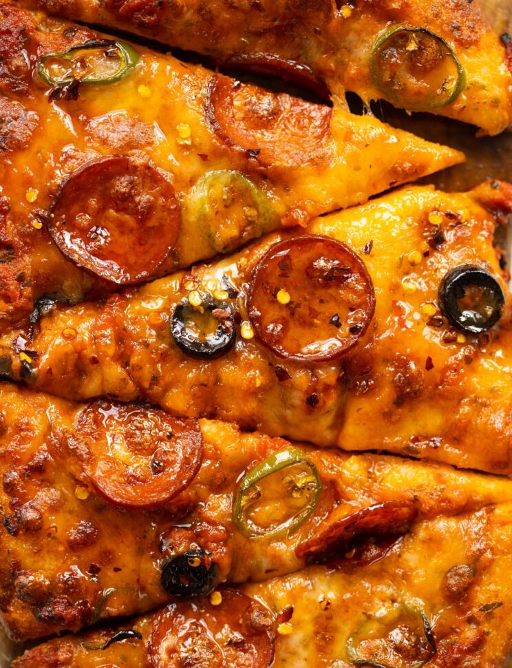 close up overhead shot of sliced hot honey pizza