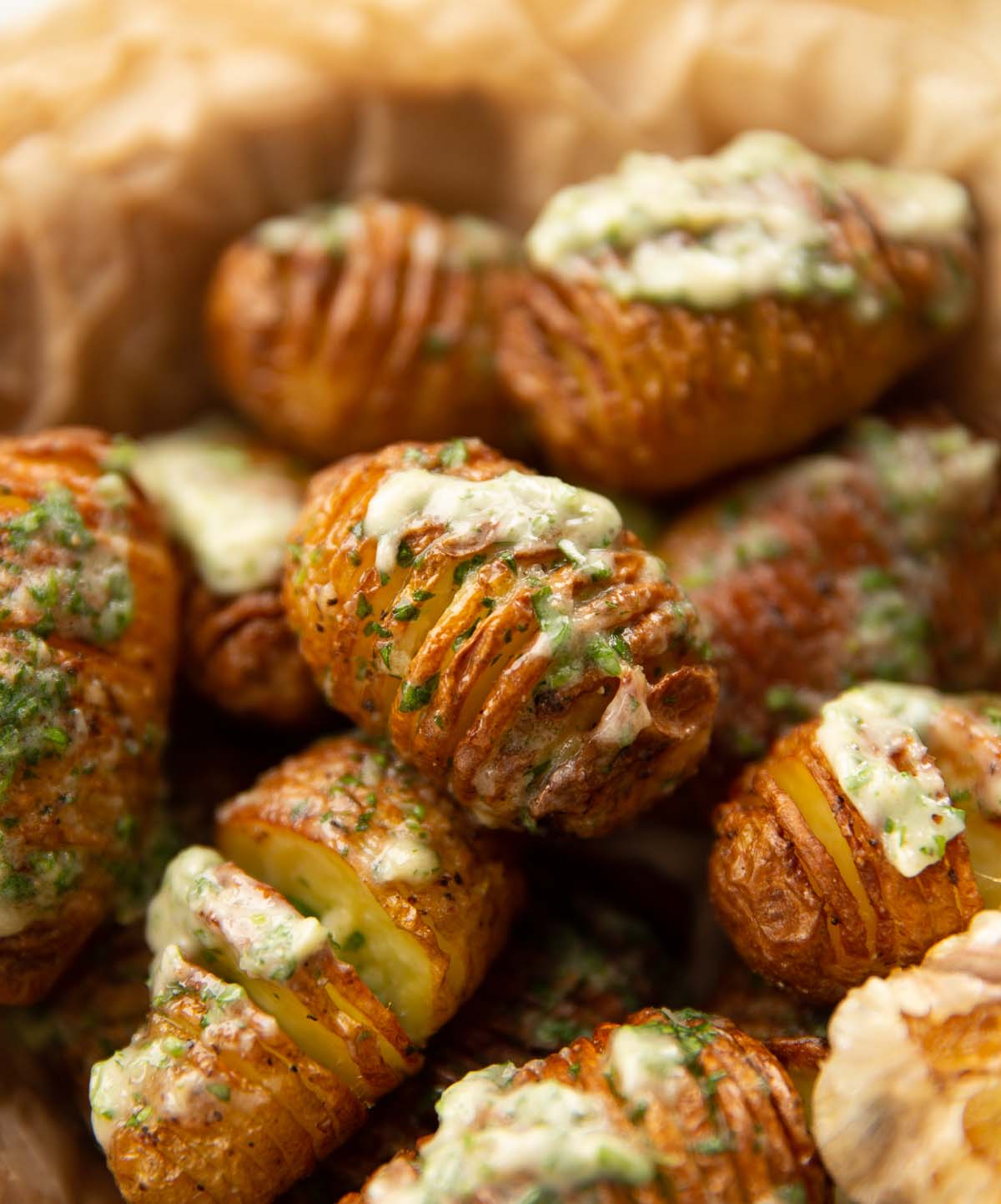 close up shot of mini garlic butter potatoes in basket