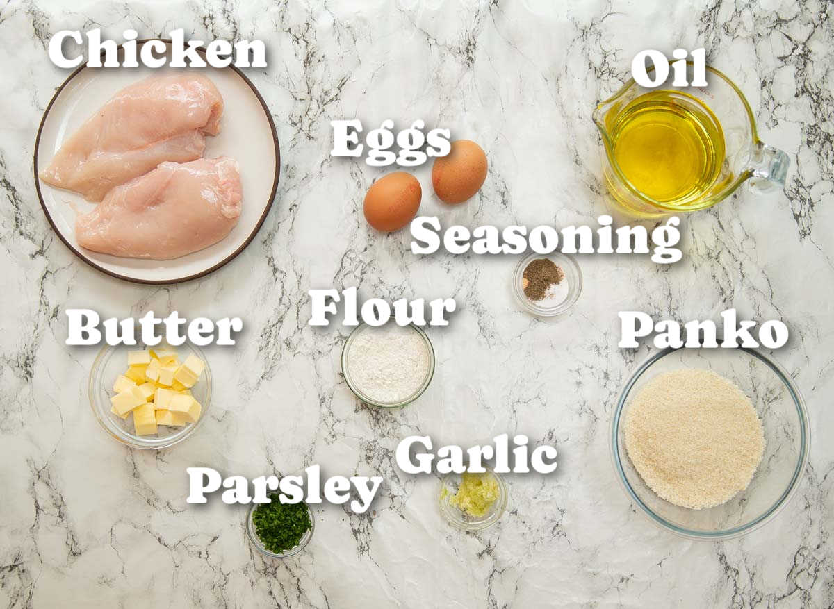 overhead shot of chicken kyiv ingredients with text labels