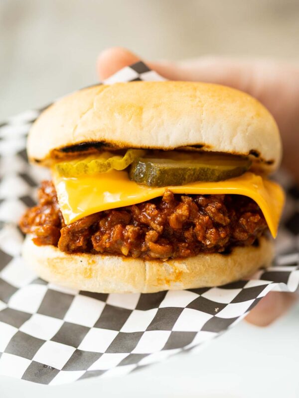 close up shot of hand holding sloppy joe