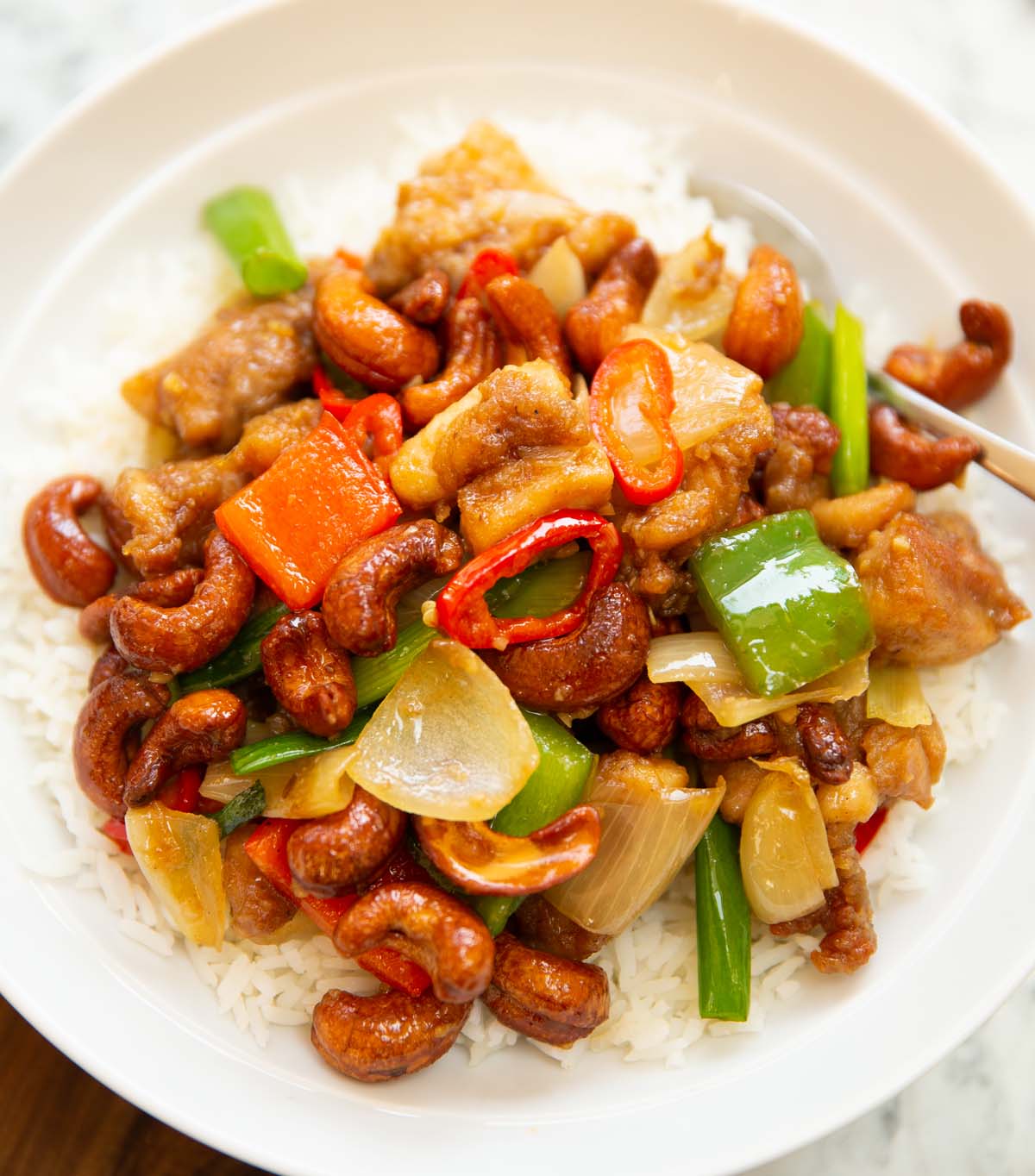 close up shot of Thai cashew chicken served on rice