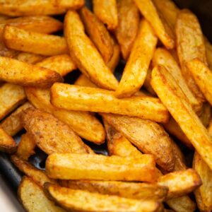 close up shot of air fryer chips in air fryer basket
