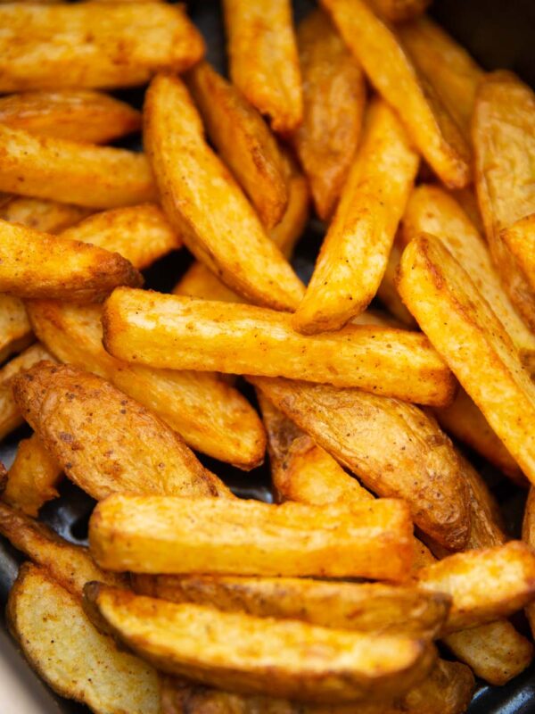 close up shot of air fryer chips in air fryer basket