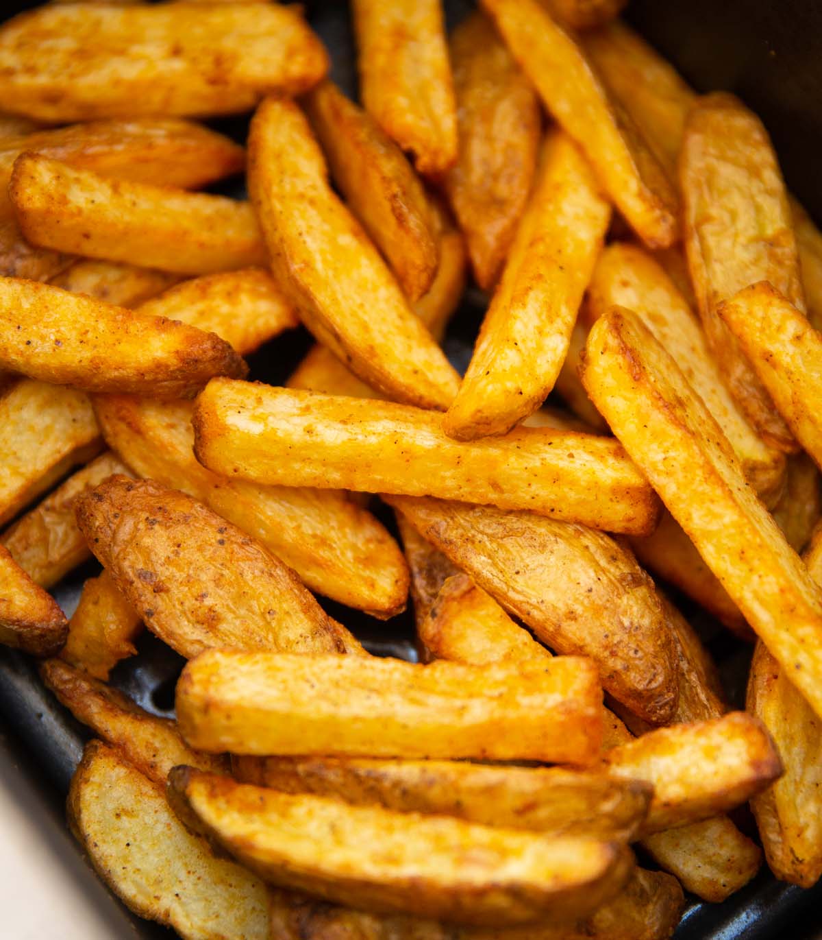 close up shot of air fryer chips in air fryer basket